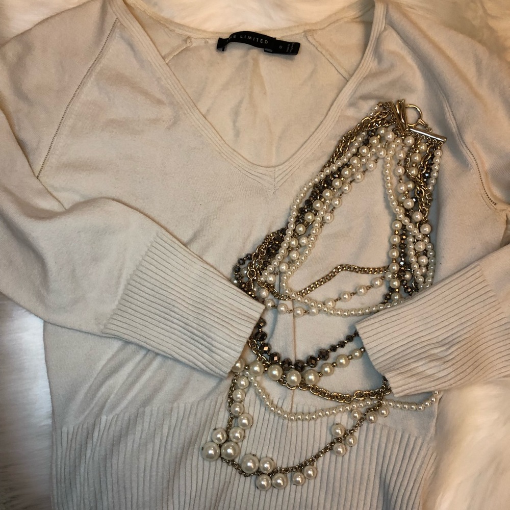 The limited stretchy cream sweater
